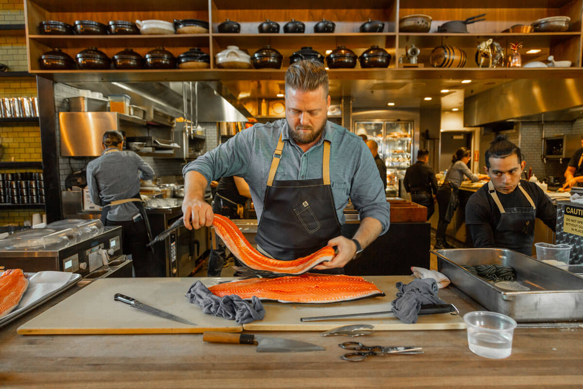 chef holding ora king salmon